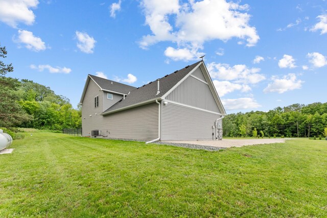 4163 Canary Rd, Royalton Twp, MN 55030 - view of home's exterior featuring a yard, central AC, and board and batten siding