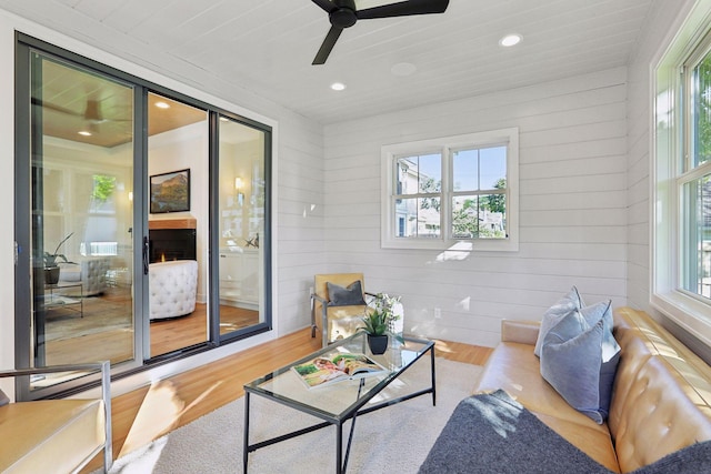 living room featuring a wealth of natural light and light hardwood / wood-style flooring