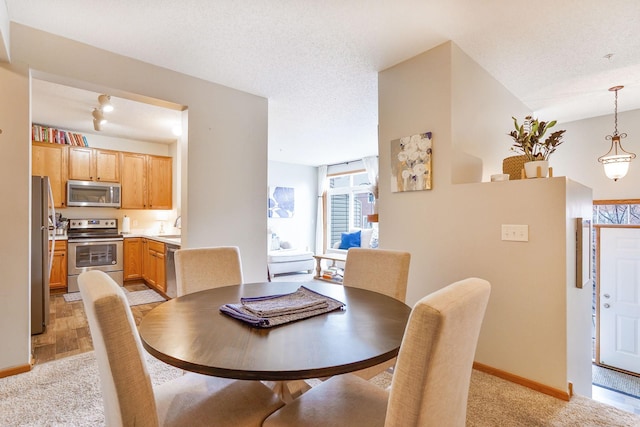 14587 Olivine Way NW, Ramsey, MN 55303 - dining space with light colored carpet and baseboards