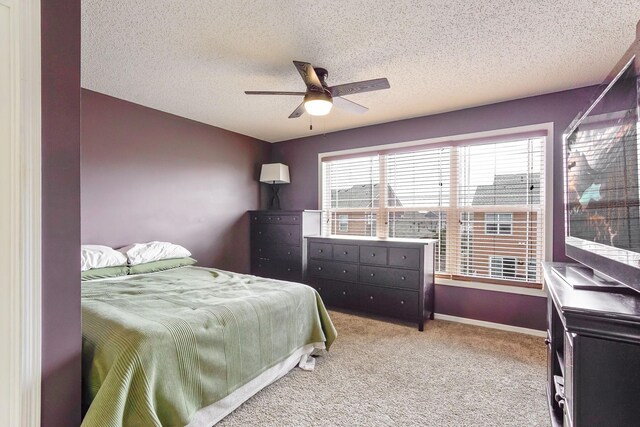 14587 Olivine Way NW, Ramsey, MN 55303 - bedroom with light carpet, a textured ceiling, ceiling fan, and baseboards