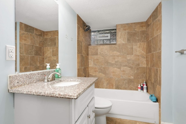 bathroom featuring vanity, toilet, bathtub / shower combination, and a textured ceiling