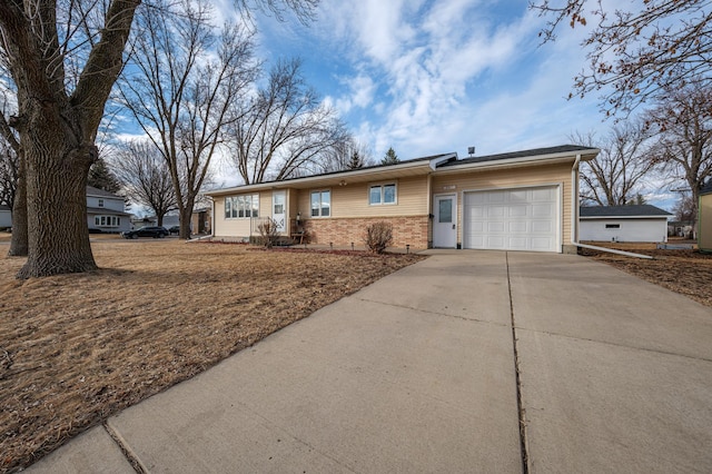 ranch-style home with a garage, driveway, and brick siding