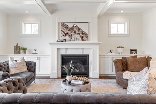 living room with coffered ceiling, crown molding, beamed ceiling, a fireplace, and light hardwood / wood-style floors