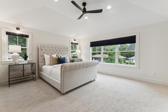 carpeted bedroom featuring lofted ceiling and ceiling fan