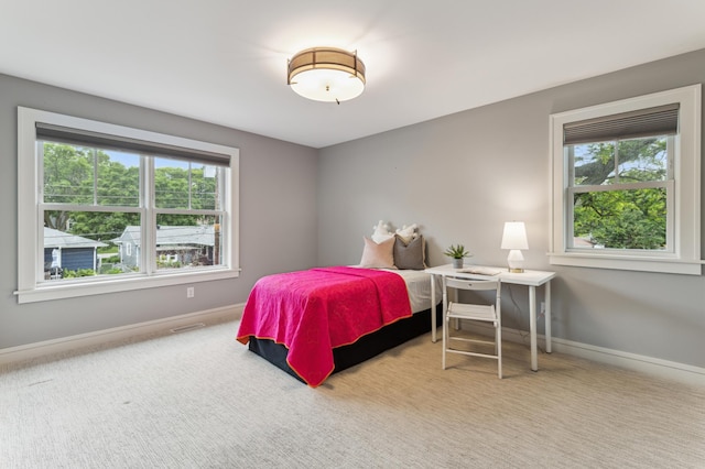 bedroom with light carpet