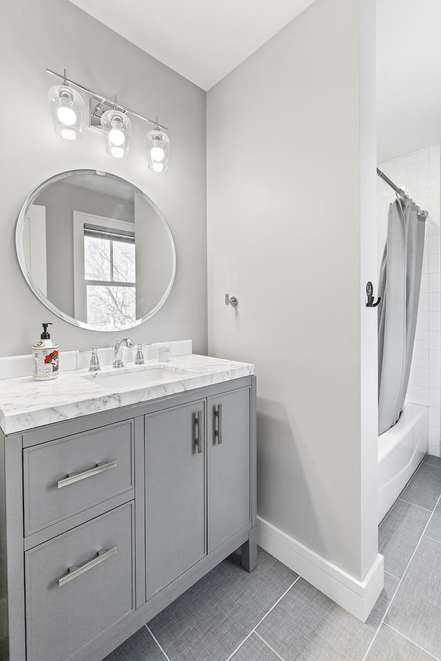 bathroom featuring vanity, tile patterned flooring, and shower / bath combo