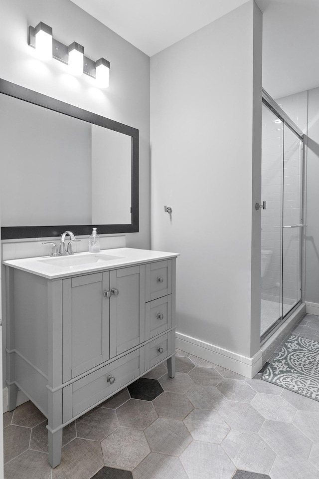 bathroom featuring vanity and walk in shower