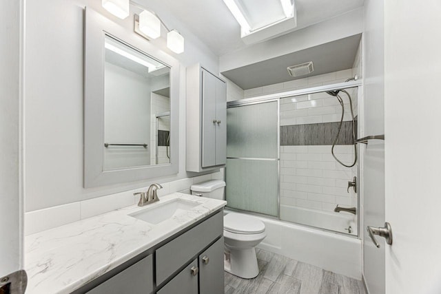 4380 Brookside Ct Unit 116, Edina, MN 55436 - bathroom featuring vanity, enclosed tub / shower combo, and wood finished floors