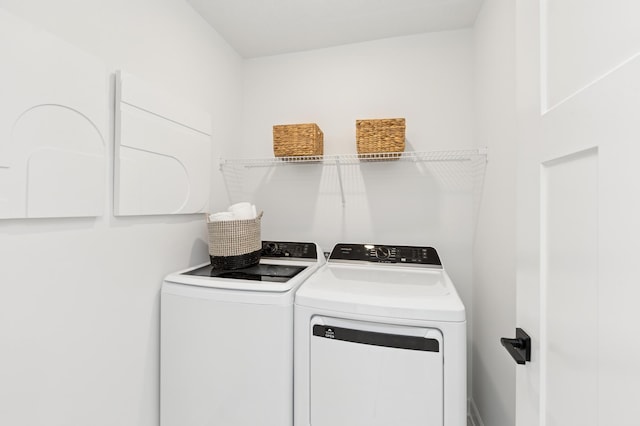 washroom with laundry area and washing machine and clothes dryer