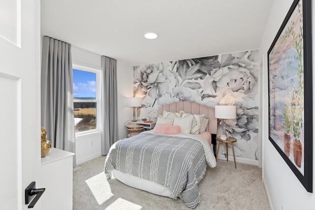 carpeted bedroom with baseboards and wallpapered walls