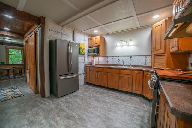 3835 Lake Rd, Barnum Twp, MN 55767 - kitchen featuring appliances with stainless steel finishes, a sink, exhaust hood, dark countertops, and recessed lighting