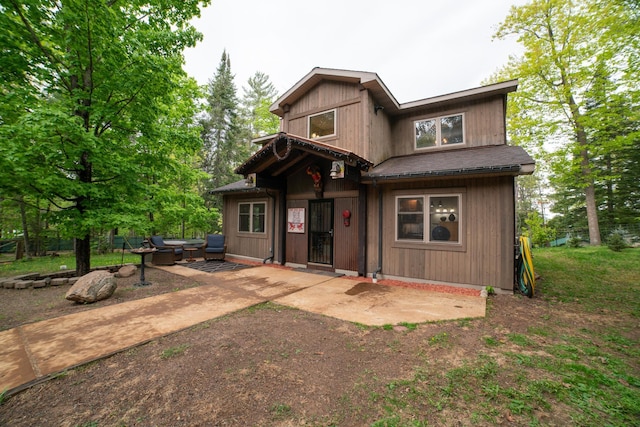 3835 Lake Rd, Barnum Twp, MN 55767 - back of property with an outdoor hangout area and a patio
