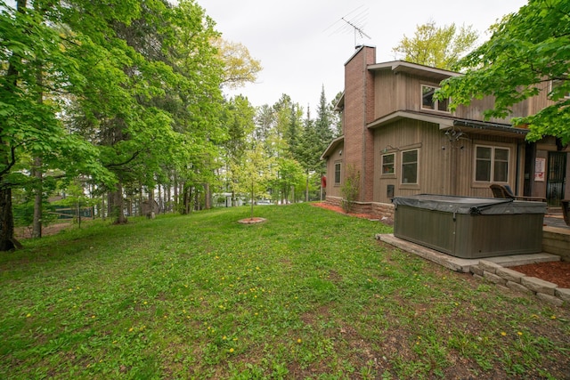 3835 Lake Rd, Barnum Twp, MN 55767 - view of grassy yard with a hot tub