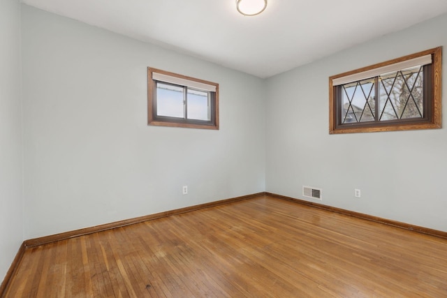 unfurnished room featuring wood-type flooring