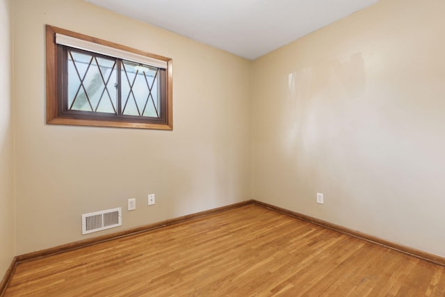 unfurnished room featuring light hardwood / wood-style floors