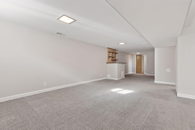 unfurnished living room featuring carpet floors