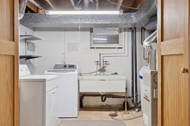 laundry room featuring sink and washing machine and clothes dryer