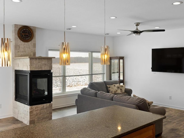 living room featuring recessed lighting, ceiling fan, and wood finished floors