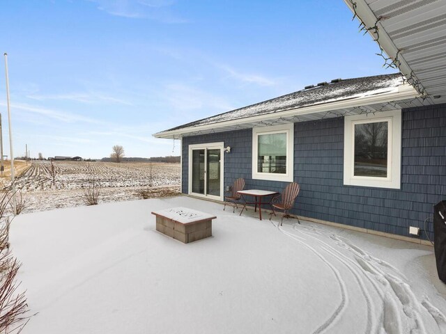 view of patio / terrace featuring an outdoor fire pit