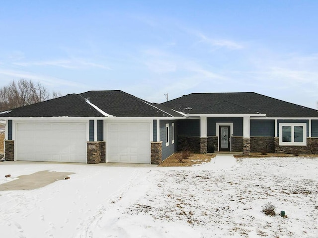 view of front of property featuring a garage, stone siding, driveway, and a shingled roof