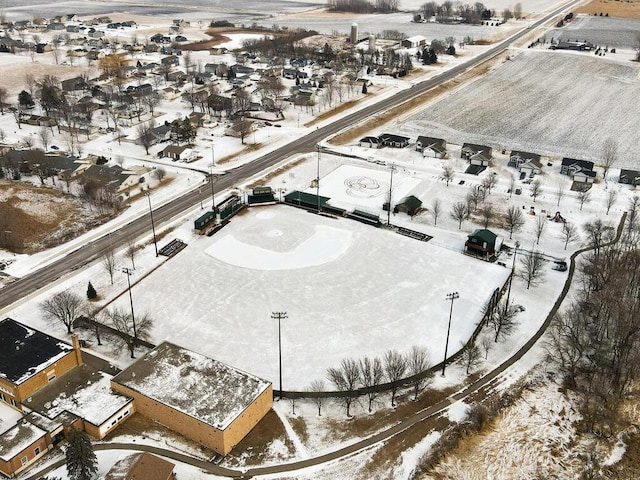 snowy aerial view featuring a residential view