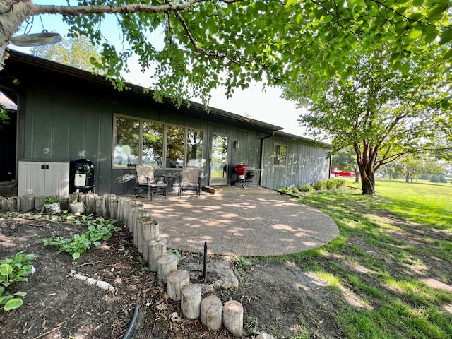 rear view of property featuring a patio area