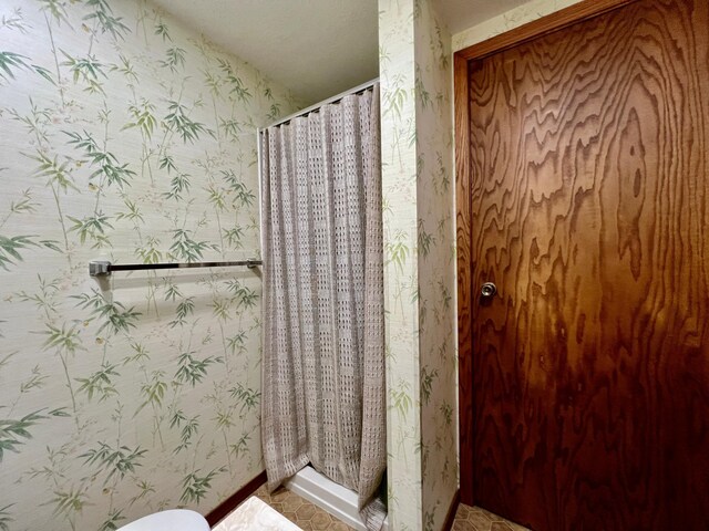 bathroom featuring walk in shower