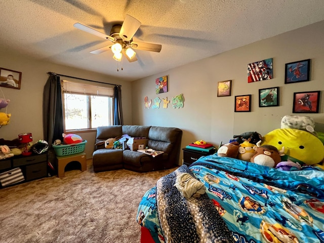 bedroom with a textured ceiling, carpet floors, and ceiling fan