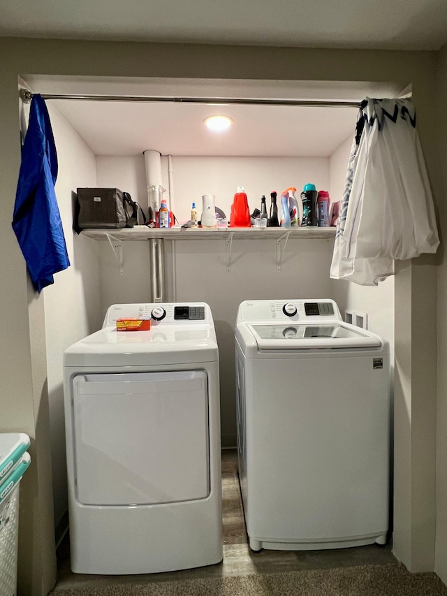 clothes washing area featuring washer and dryer