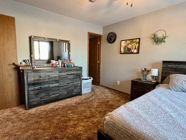 carpeted bedroom with a textured ceiling