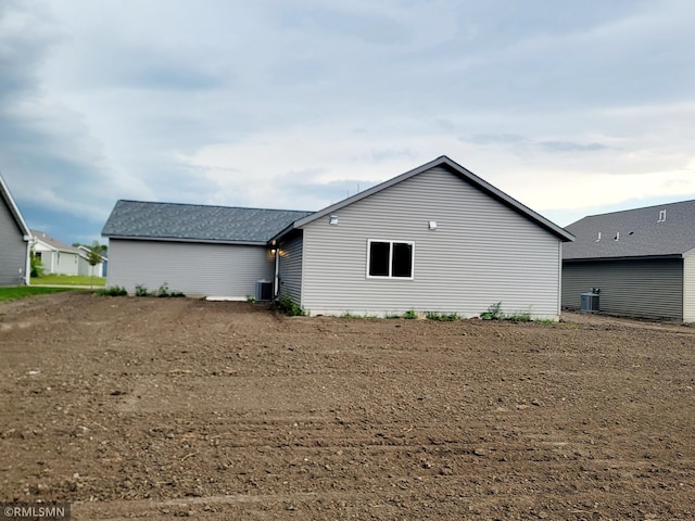 back of property featuring central AC unit