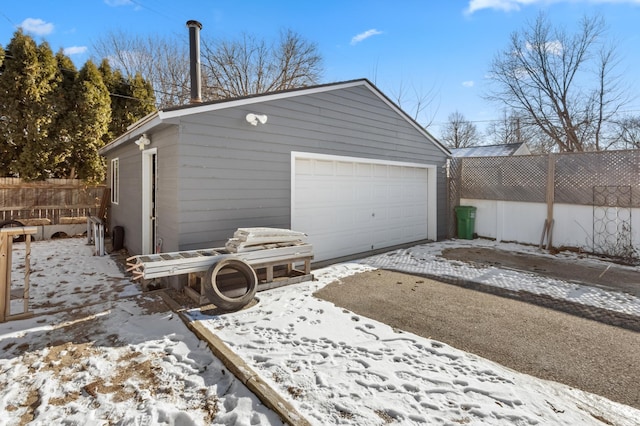 view of snow covered garage