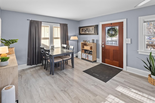 dining area with light hardwood / wood-style floors