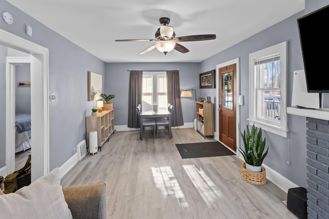 foyer featuring ceiling fan and light wood-type flooring