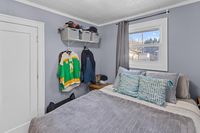 bedroom featuring crown molding