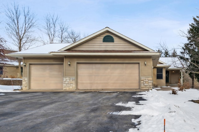 ranch-style home with a garage