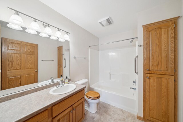 full bathroom featuring vanity, tile patterned flooring, shower / tub combination, and toilet