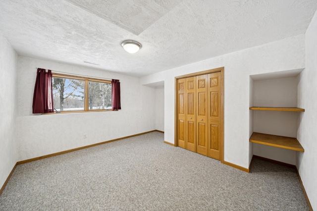 unfurnished bedroom with carpet flooring and a closet