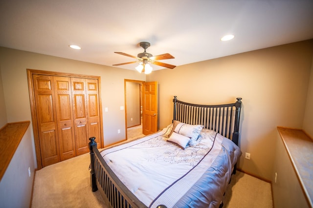 carpeted bedroom with a closet and ceiling fan