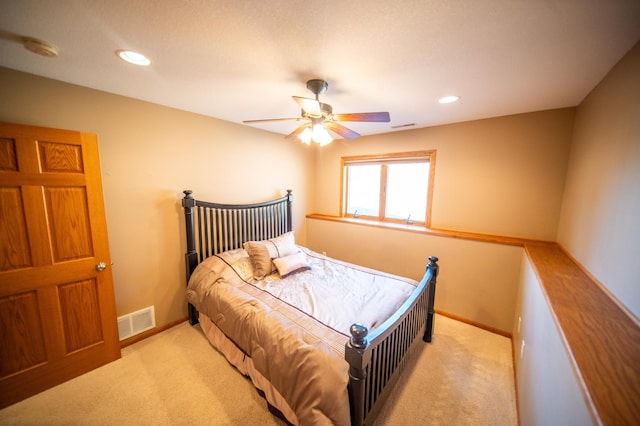 carpeted bedroom featuring ceiling fan