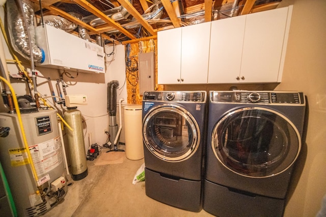 laundry room with independent washer and dryer, gas water heater, electric panel, and cabinets