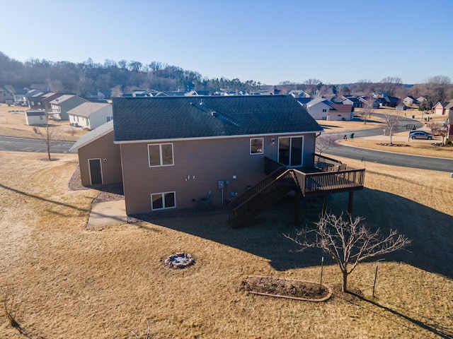 back of property featuring a wooden deck