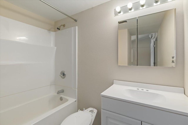 full bathroom featuring vanity, shower / tub combination, and toilet