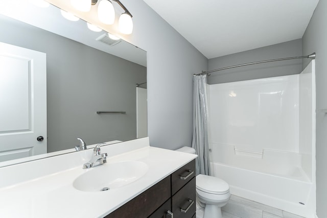 bathroom with toilet, shower / tub combo, visible vents, and vanity