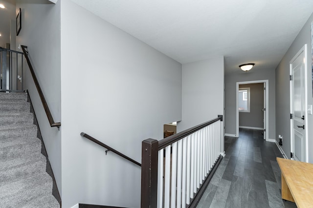 interior space featuring baseboards and wood finished floors