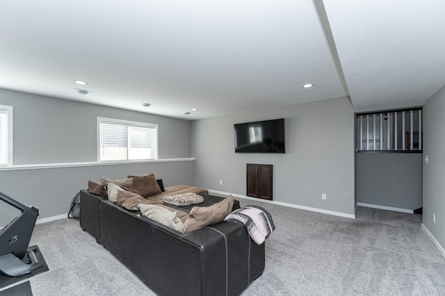 carpeted living room featuring recessed lighting and baseboards