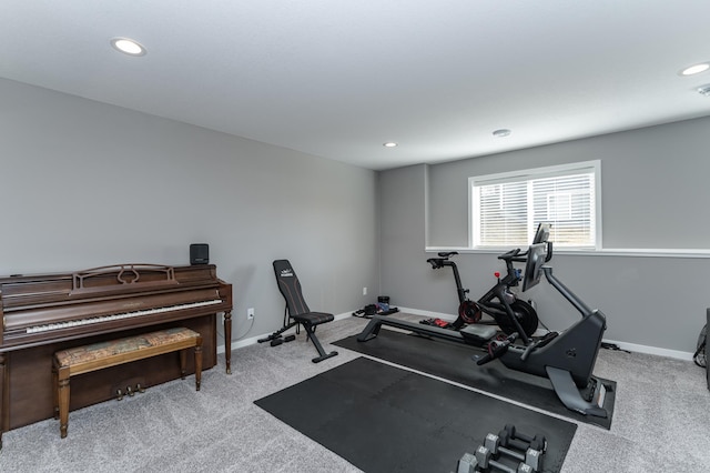 exercise room with carpet, baseboards, and recessed lighting