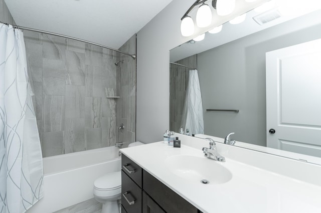 full bathroom with visible vents, shower / bath combo with shower curtain, vanity, and toilet