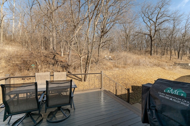 wooden deck featuring outdoor dining space