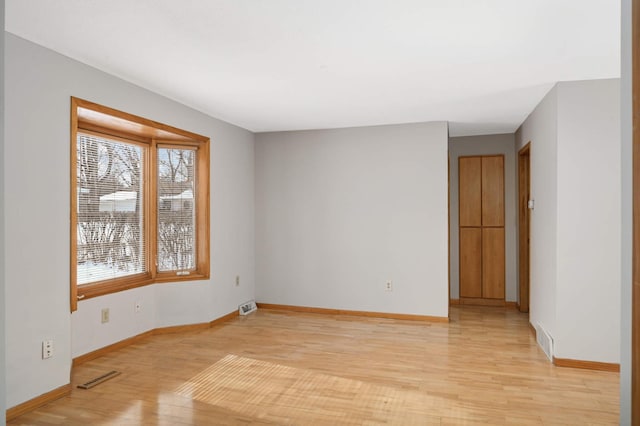 unfurnished room featuring light wood-type flooring